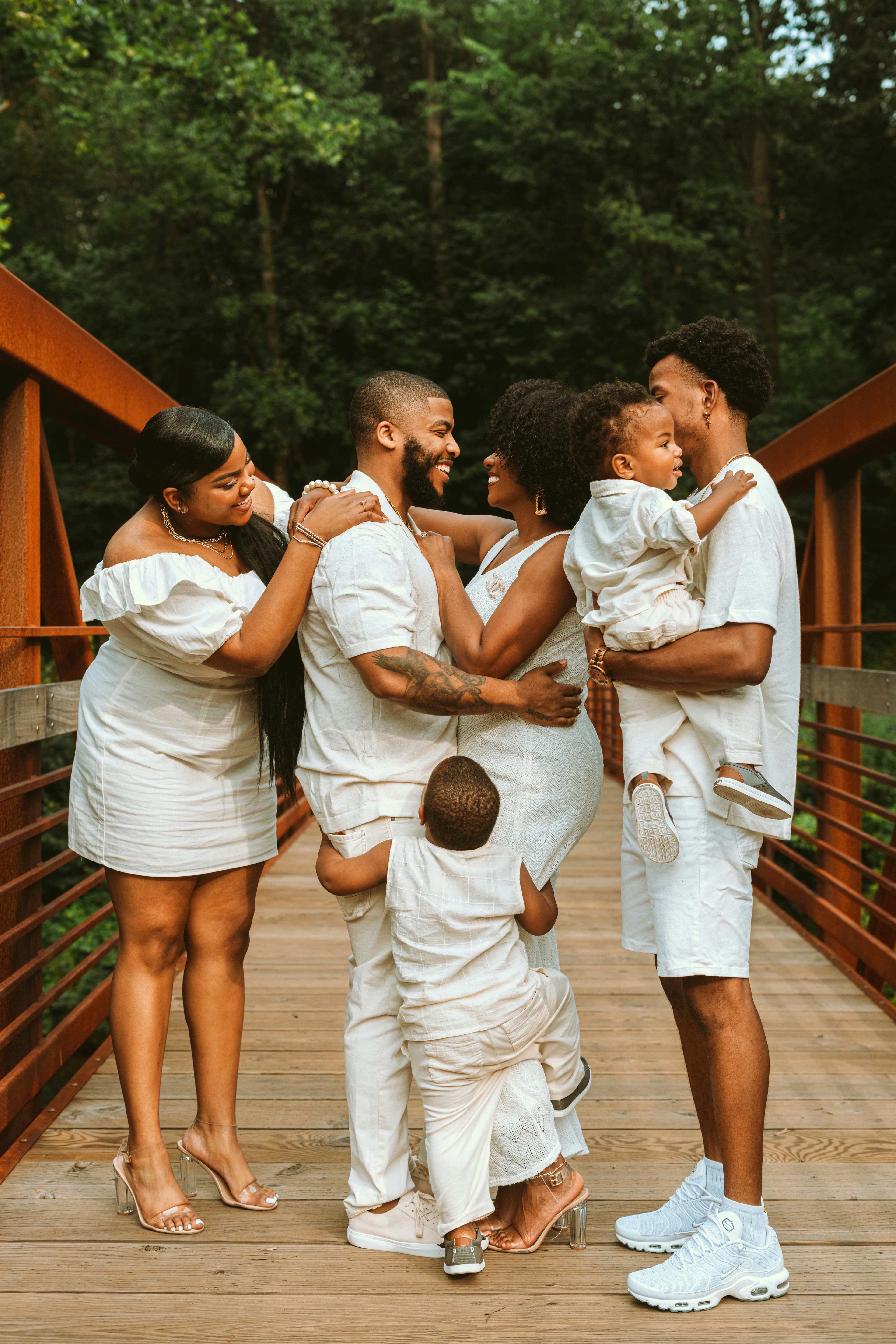 An expectant couple embracing, planning their family together