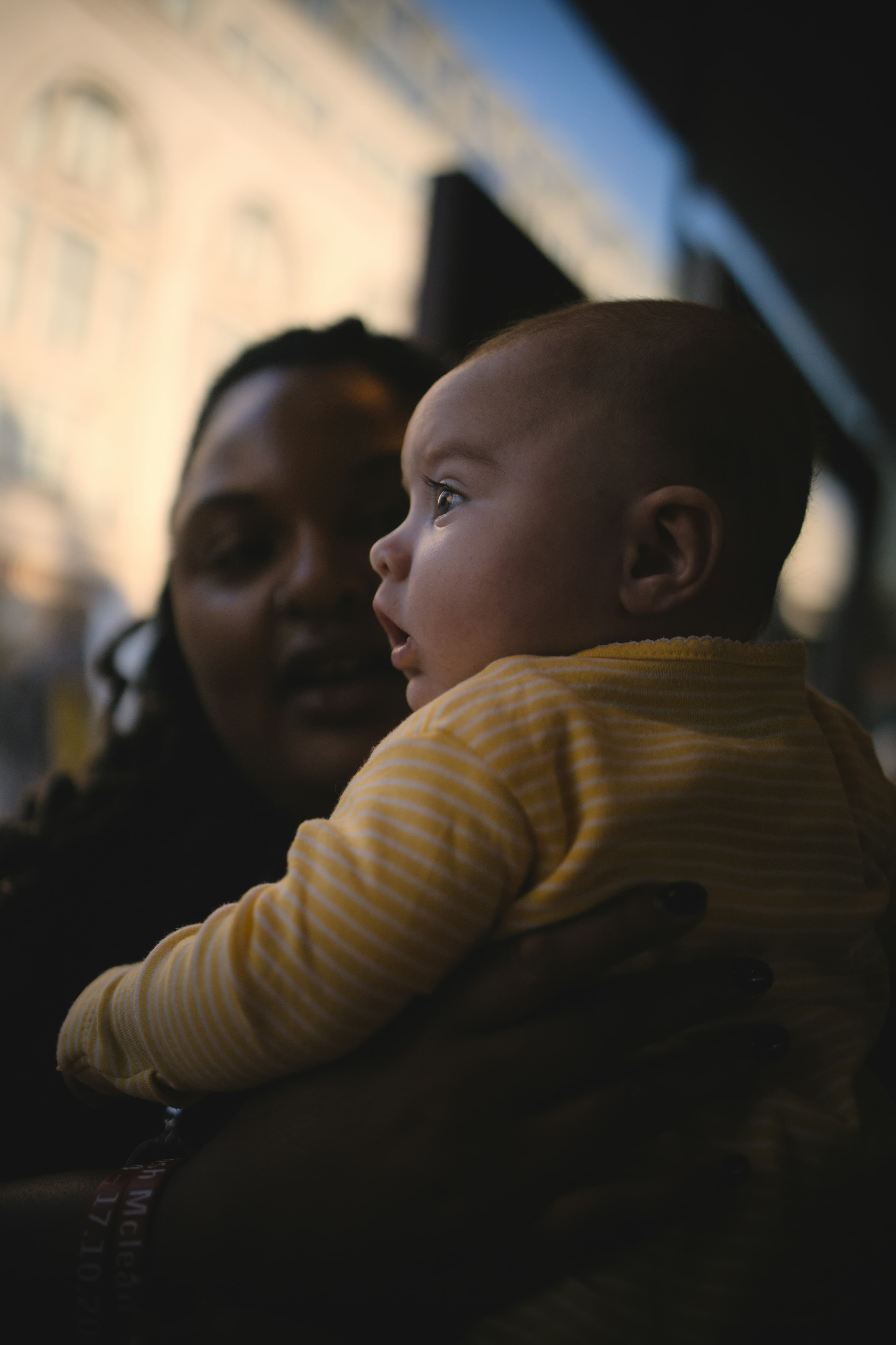 A newborn cradled gently